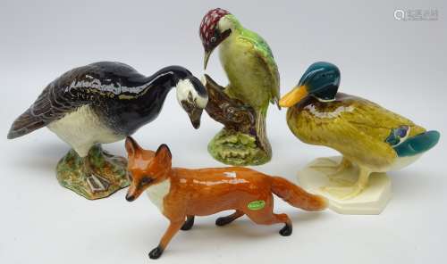 Four Beswick figures; Barnacle Goose 1052, Woodpecker 1218,