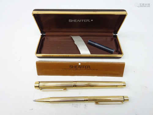 Sheaffer Targa gold-plated fountain and ball point pen set, 14k nib,