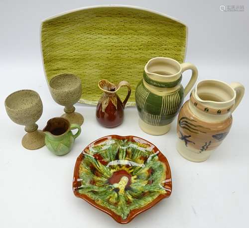 Rye Pottery dish with sgraffito type decoration, two Southwold pottery jugs,