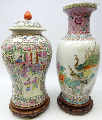 Chinese Famille Rose vase of baluster form decorated with Peacocks on rock work amongst foliage on