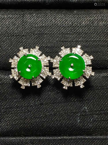 AN ICY ZHENGYANG GREEN BUTTON SHAPED JADEITE STUD EARRINGT