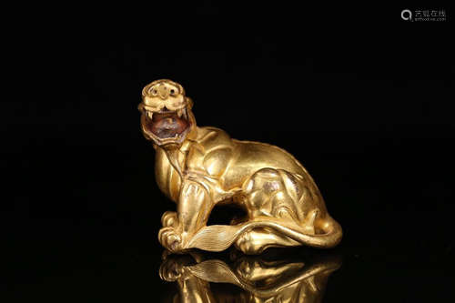 A GILT BRONZE ORNAMENT OF BEAST