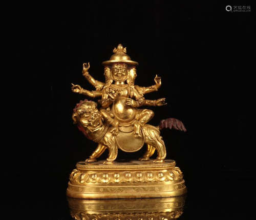 A GILT BRONZE BUDDHA ORNAMENT