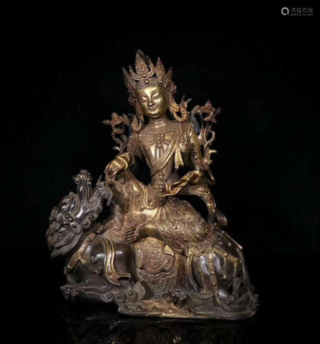 A COPPER BUDDHA ORNAMENT