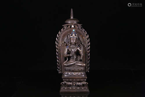 A COPPER BUDDHA ORNAMENT