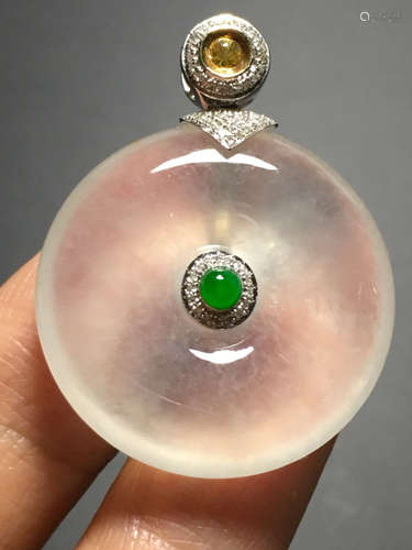 AN ICY GREEN BUTTON SHAPED JADEITE PENDANT