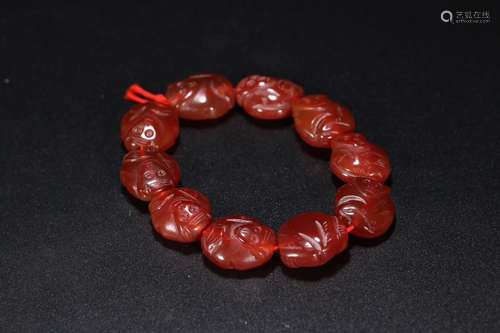 A RED AGATE BRACELET OF MONKEY CARVING