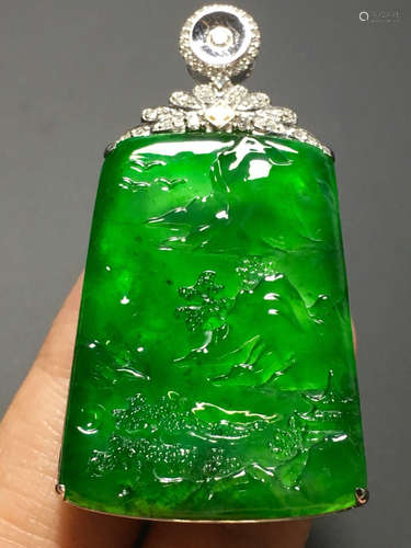 AN ICY GREEN JADEITE PENDANT