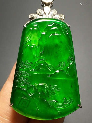 AN ICY ZHENGYANG GREEN JADEITE PENDANT