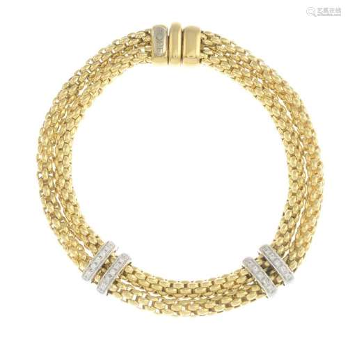 FOPE - an 18ct gold diamond 'Maori' bracelet. The two