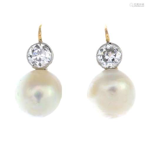 A pair of natural pearl and diamond earrings. Each