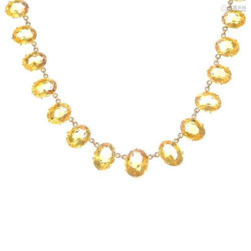 A citrine necklace. Designed as a graduated oval-shape