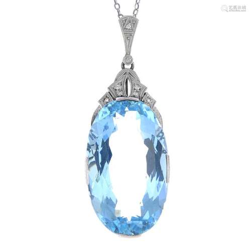 An aquamarine and diamond pendant. The oval-shape