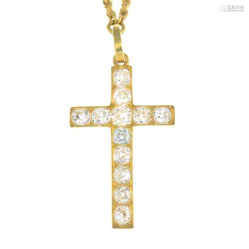 A diamond cross pendant. The old-cut diamond cross,