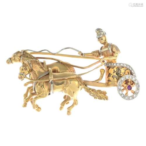 A ruby and diamond brooch. Designed as a charioteer