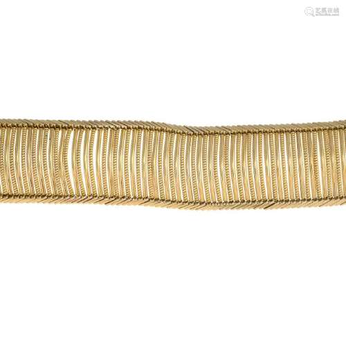 A mid 20th century 18ct gold bracelet. The curved,