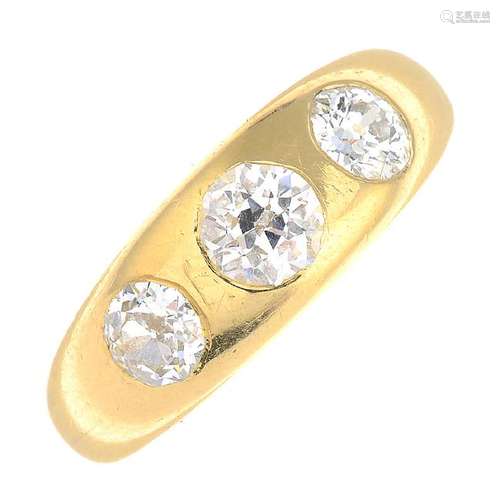 An early 20th century diamond three-stone band ring.