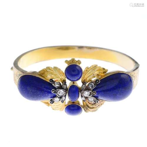 A lapis lazuli and diamond hinged bangle. Designed as a