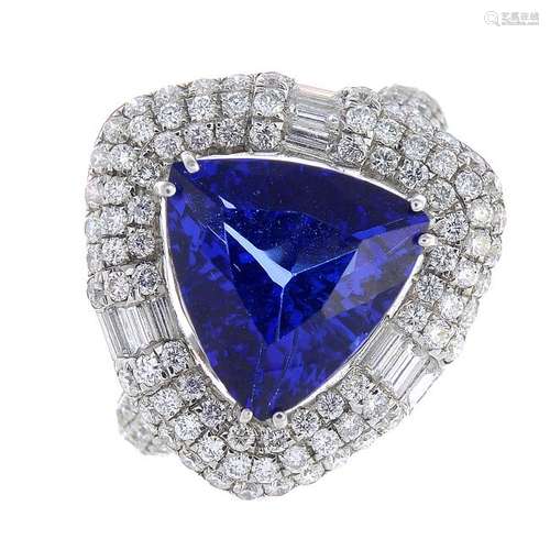 An 18ct gold tanzanite and diamond cluster ring. The