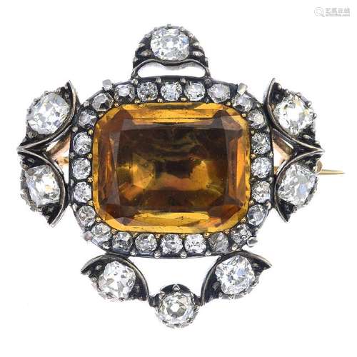 An early 19th century silver and gold, topaz and