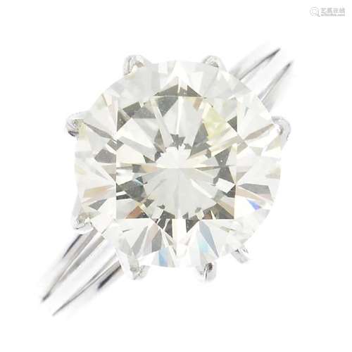 A brilliant-cut diamond, weighing 5.21cts, with ring