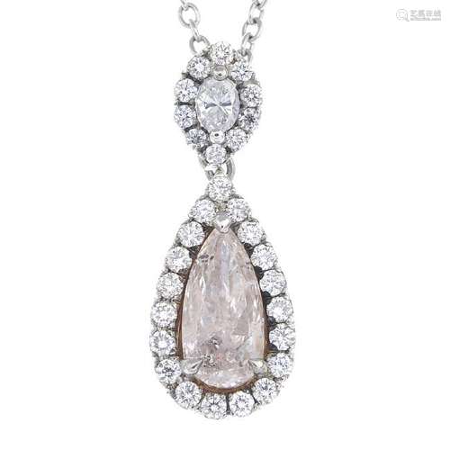 A coloured diamond and diamond cluster pendant. The