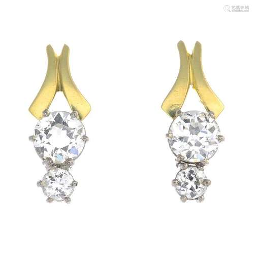 A pair of 18ct gold diamond earrings. Each designed as