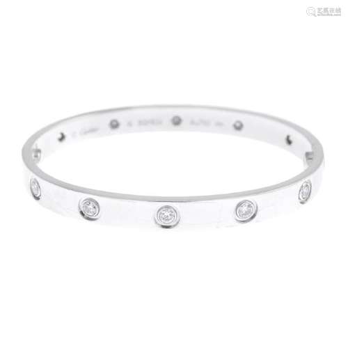 CARTIER - an 18ct gold diamond 'Love' bangle. The