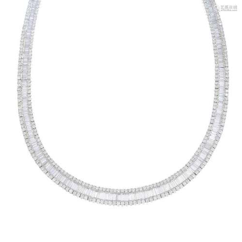 A diamond necklace. The graduated baguette-cut diamond