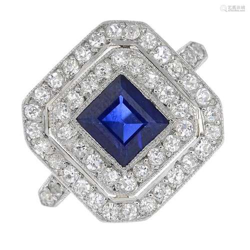 A sapphire and diamond cluster ring. The square-shape