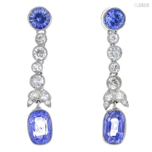 A pair of sapphire and diamond earrings. Each designed