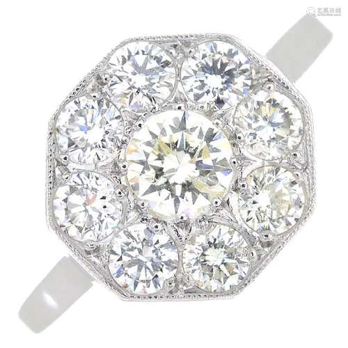 A diamond cluster ring. Of octagonal outline, the