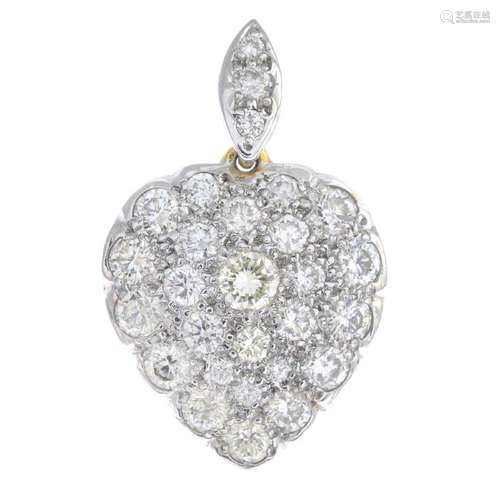 A diamond pendant. The pave-set diamond heart, with