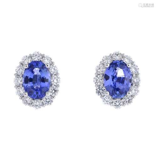 A pair of sapphire and diamond cluster earrings. Each