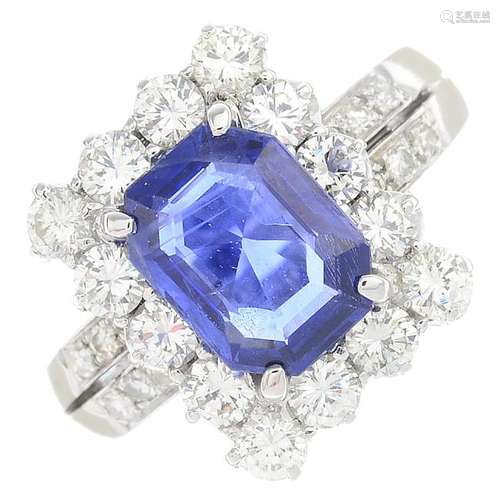 A sapphire and diamond cluster ring. The