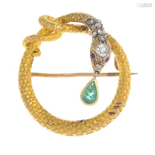 A late Victorian gold diamond and gem-set snake brooch.