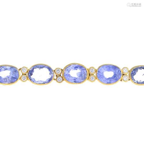 A sapphire and diamond bracelet. The graduated