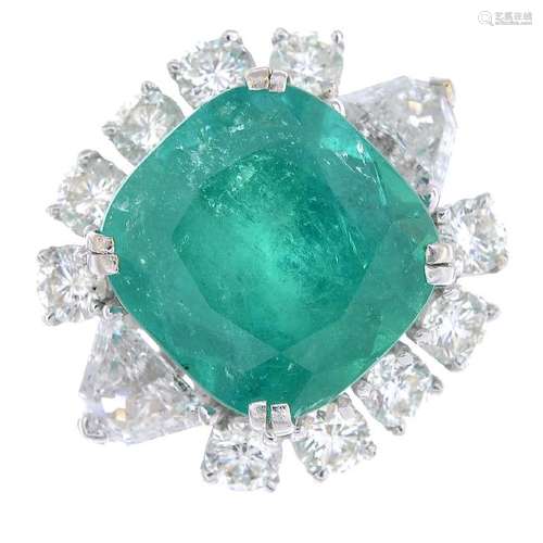 A Colombian emerald and diamond ring. The cushion-shape