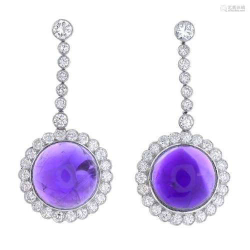 A pair of amethyst and diamond earrings. Each designed