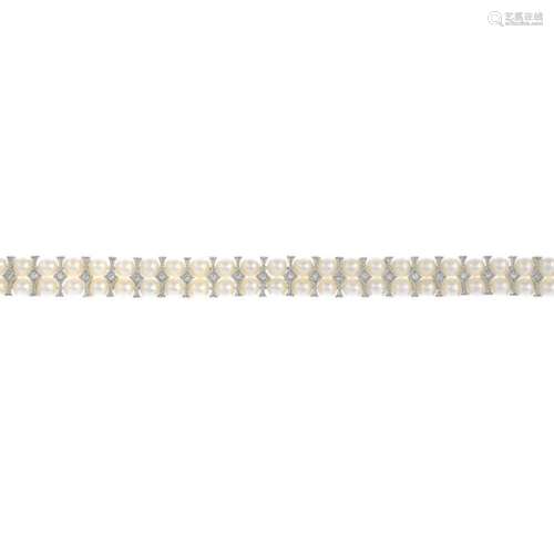 An 18ct gold, cultured pearl and diamond bracelet.