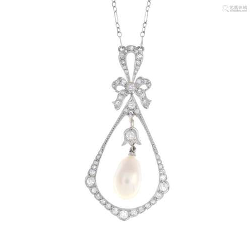 A platinum natural pearl and diamond pendant. The drop