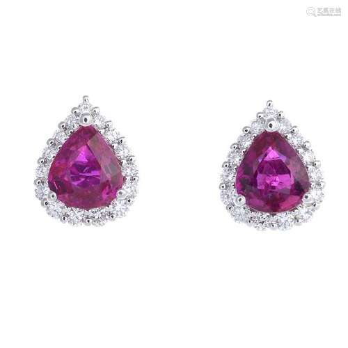 A pair of ruby and diamond cluster earrings. Each