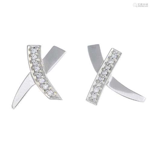 TIFFANY & CO. - a pair of diamond 'Kiss' earrings. Each