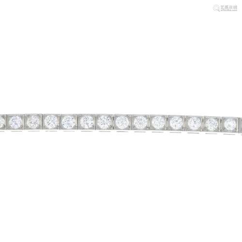 CARTIER - a mid 20th century platinum diamond bracelet.