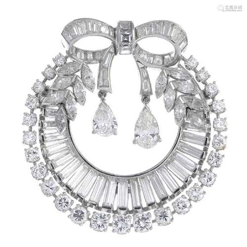 A diamond brooch. Designed as a graduated baguette and