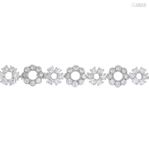 An 18ct gold diamond bracelet. Designed as an