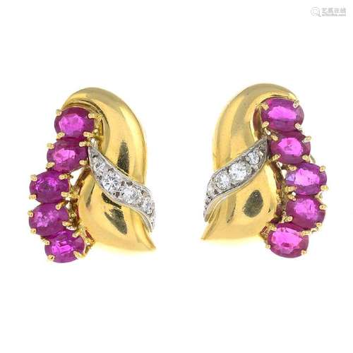 A pair of 18ct gold ruby and diamond earrings. Each