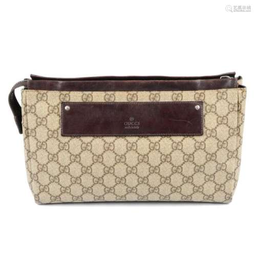GUCCI - a GG Supreme toiletry pouch. Crafted from