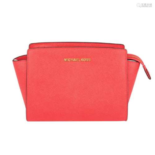 MICHAEL KORS - a coral pink Selma crossbody handbag.