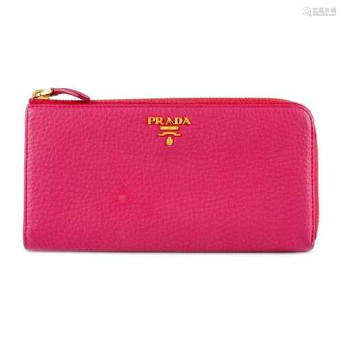 PRADA - a pink zip around wallet. Crafted from soft